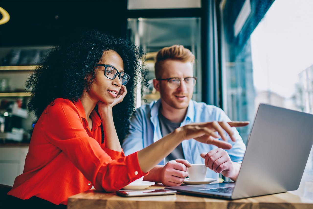 two marketers working on their computers and try to find how to create inbound email marketing campaigns