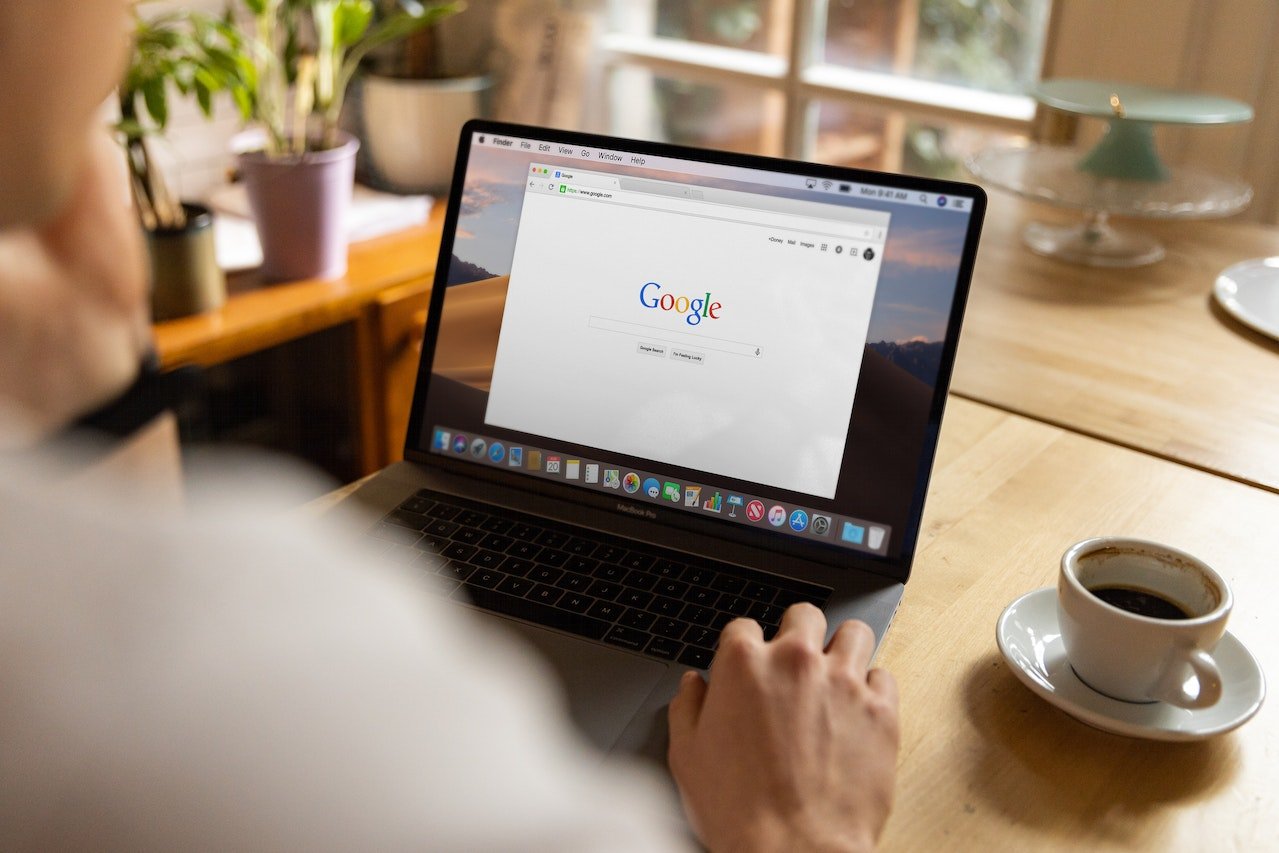 a man checking Google using a MacBook Pro