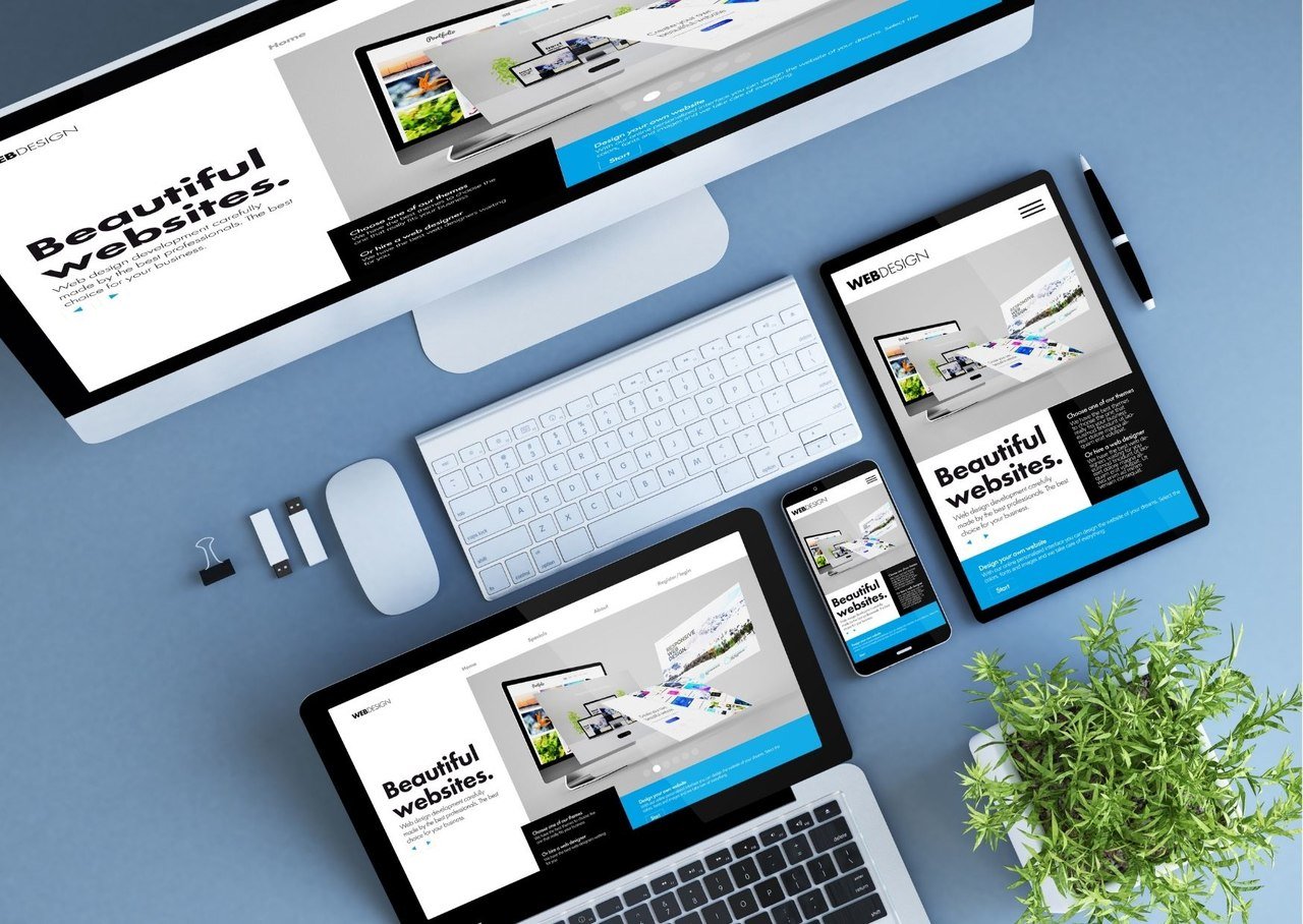 above the fold examples are shown on different technological devices with keyboard, mouse, a plant and items