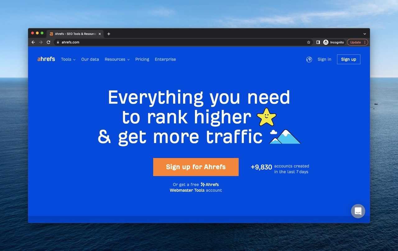 Ahrefs webpage as an above the fold example on a blue background, motto and a shining star