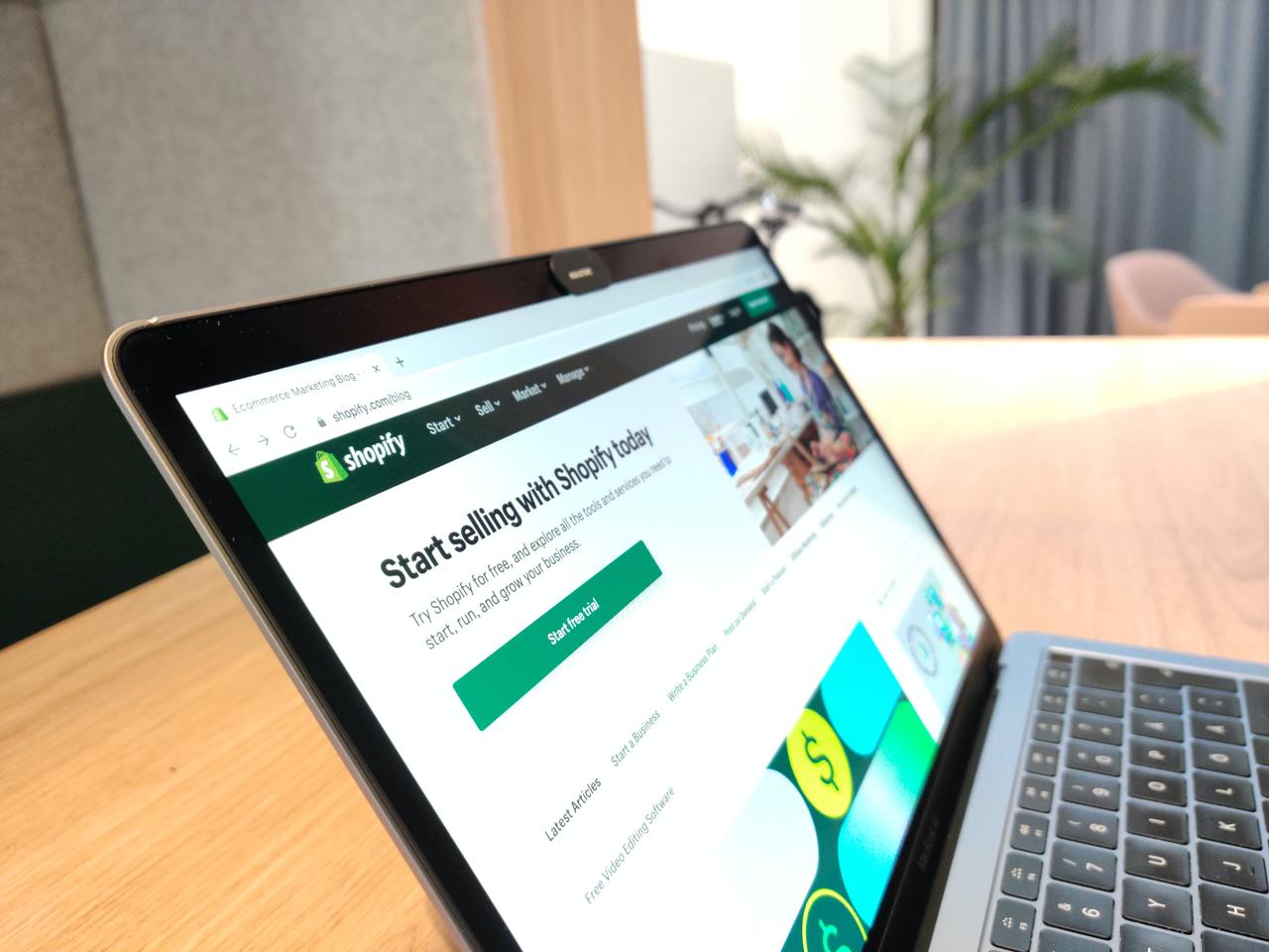 a stock photo of a laptop showing Shopify website from a narrow angle