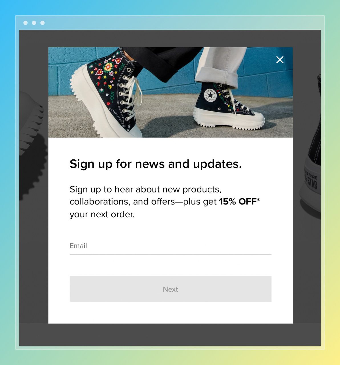 the screenshot of converse popup with a pair of converse above and email box below