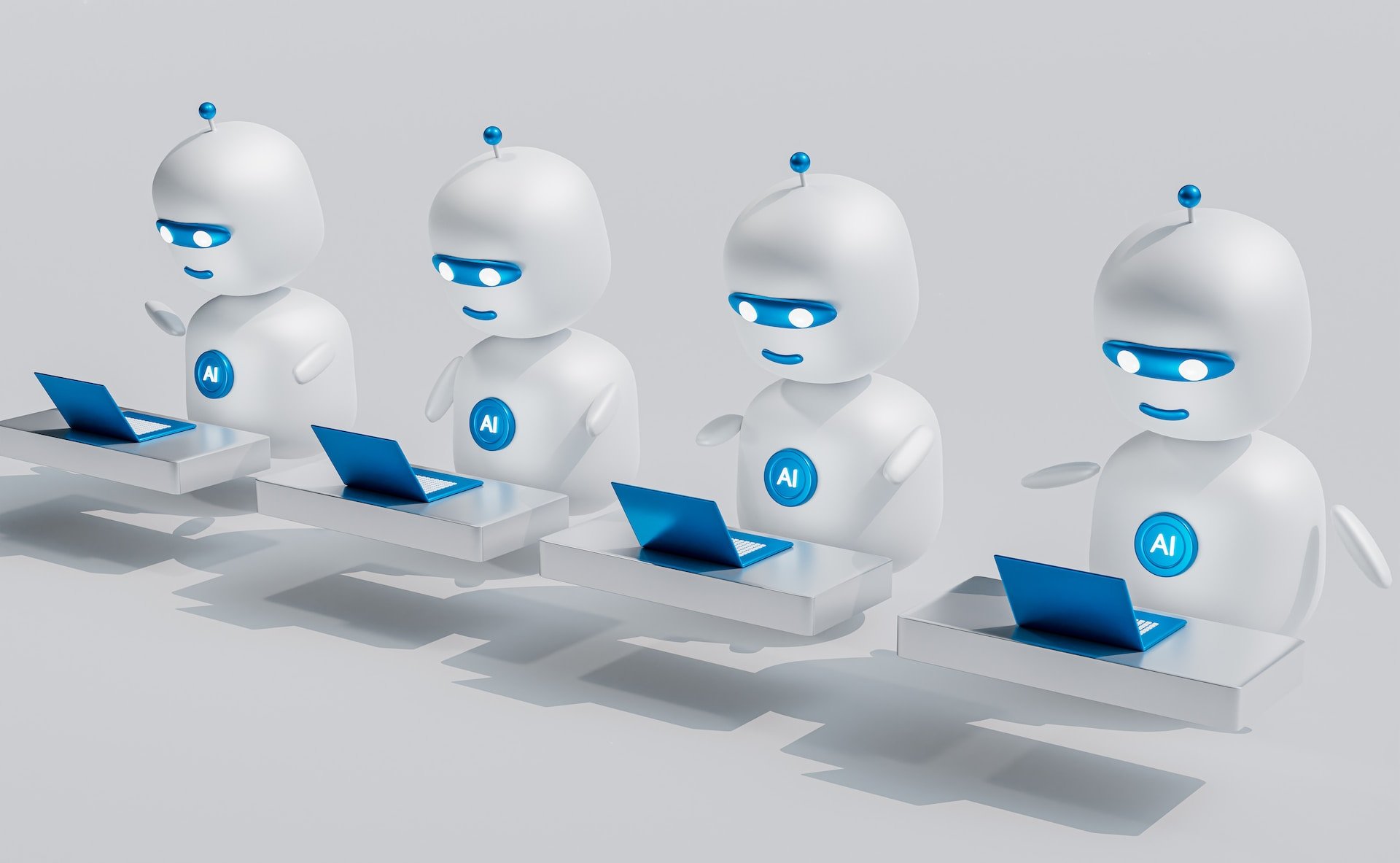 a group of white robots using laptops