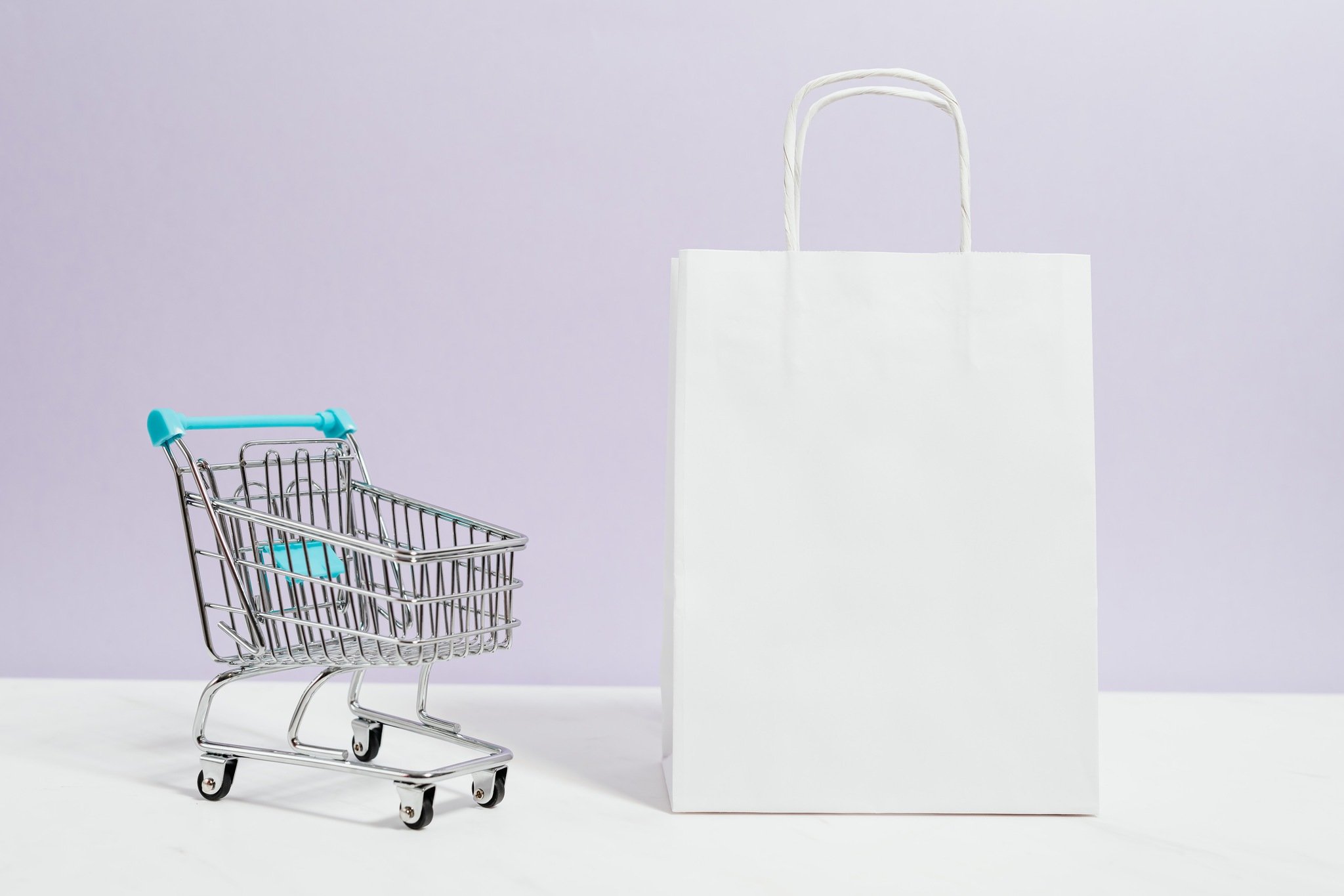 a push cart and a white paper bag