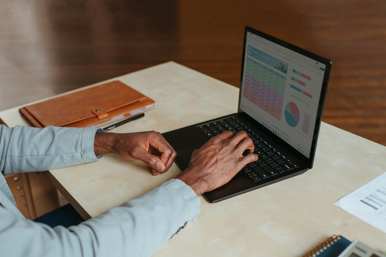 a person using a laptop and checking data