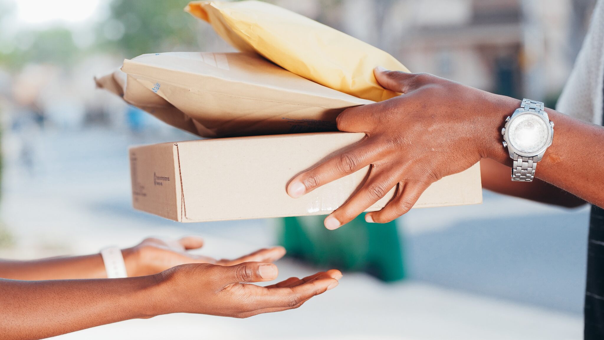 a person handing over packages