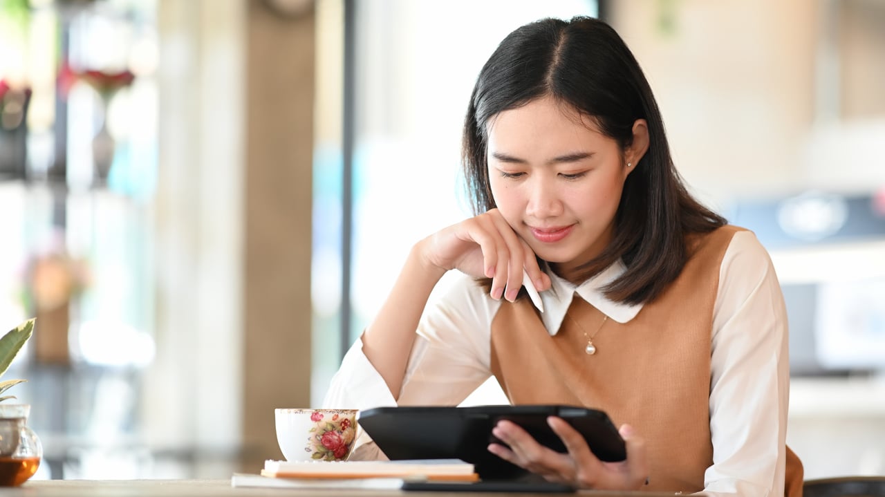 young woman examining and thinking