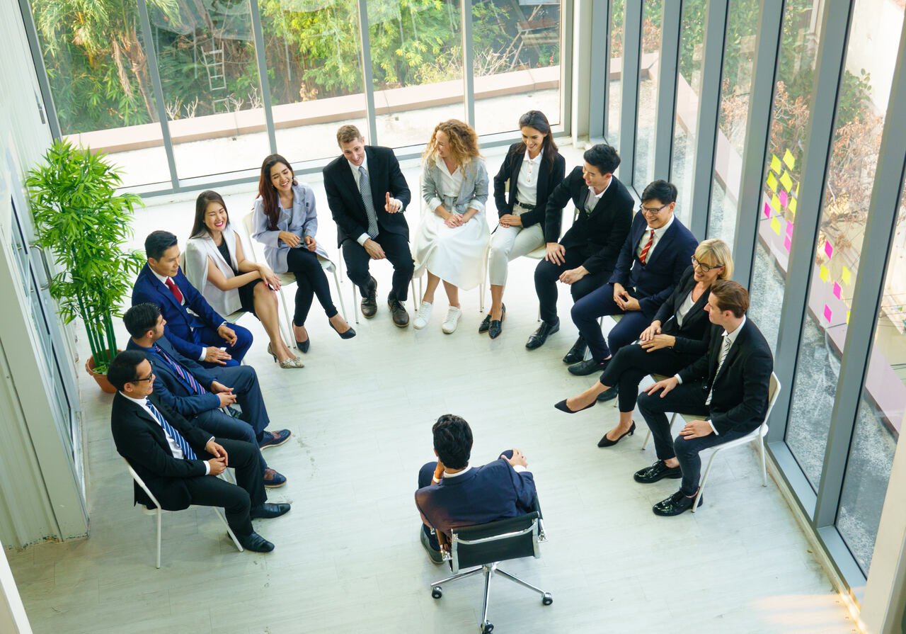 diverse group of people community togetherness sitting as a circle