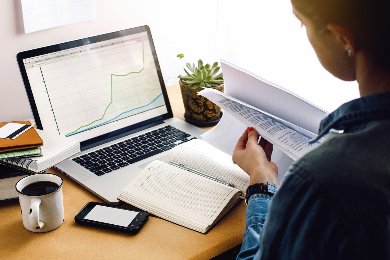 woman checking analytics on laptop