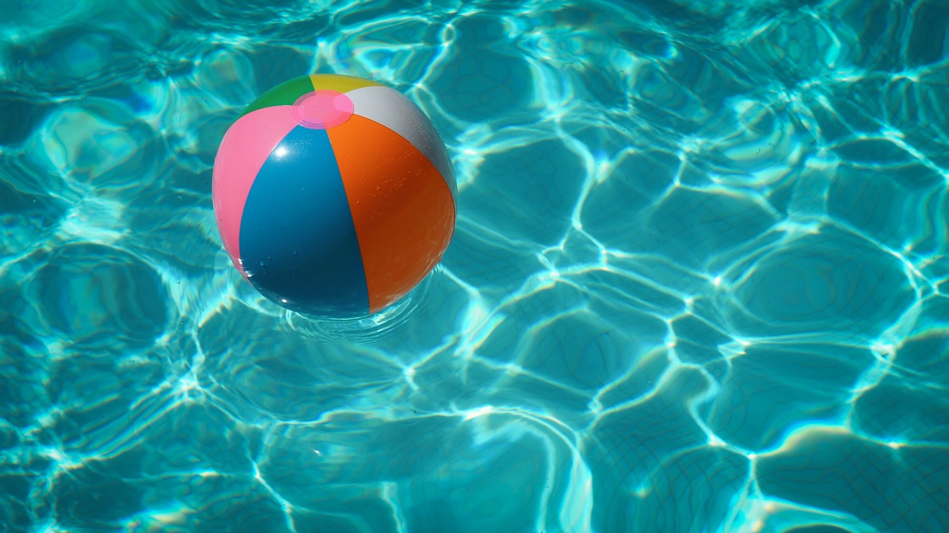 swimming pool with a colorful ball