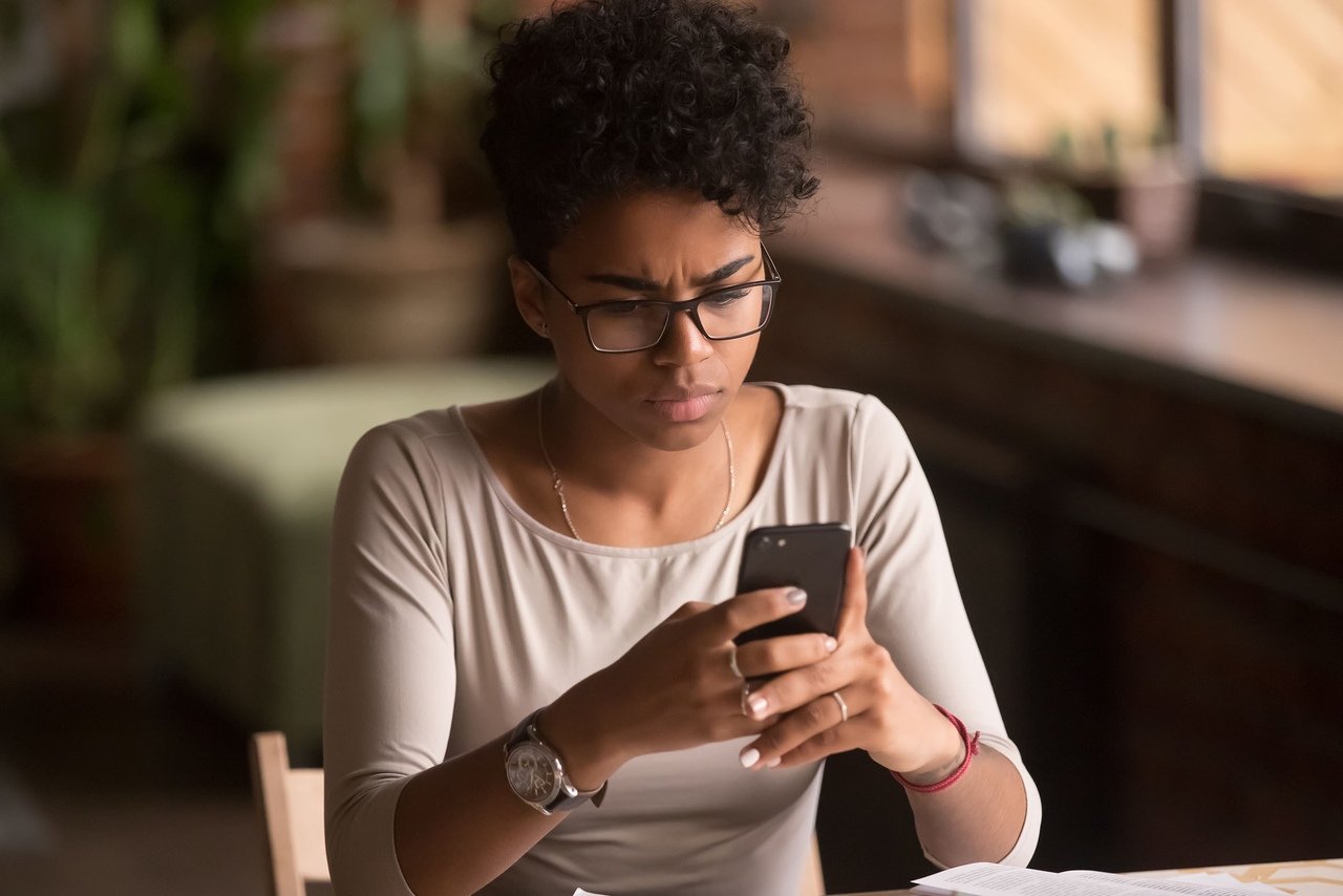 concerned customer woman holding her mobile