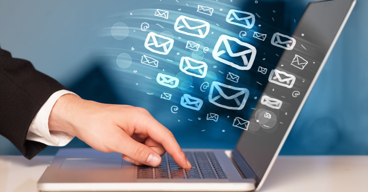 man pressing the laptop keyboard with email concept