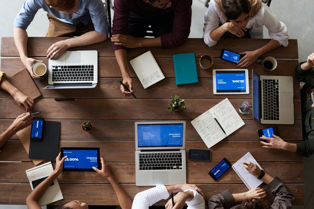 coworkers working together with laptops