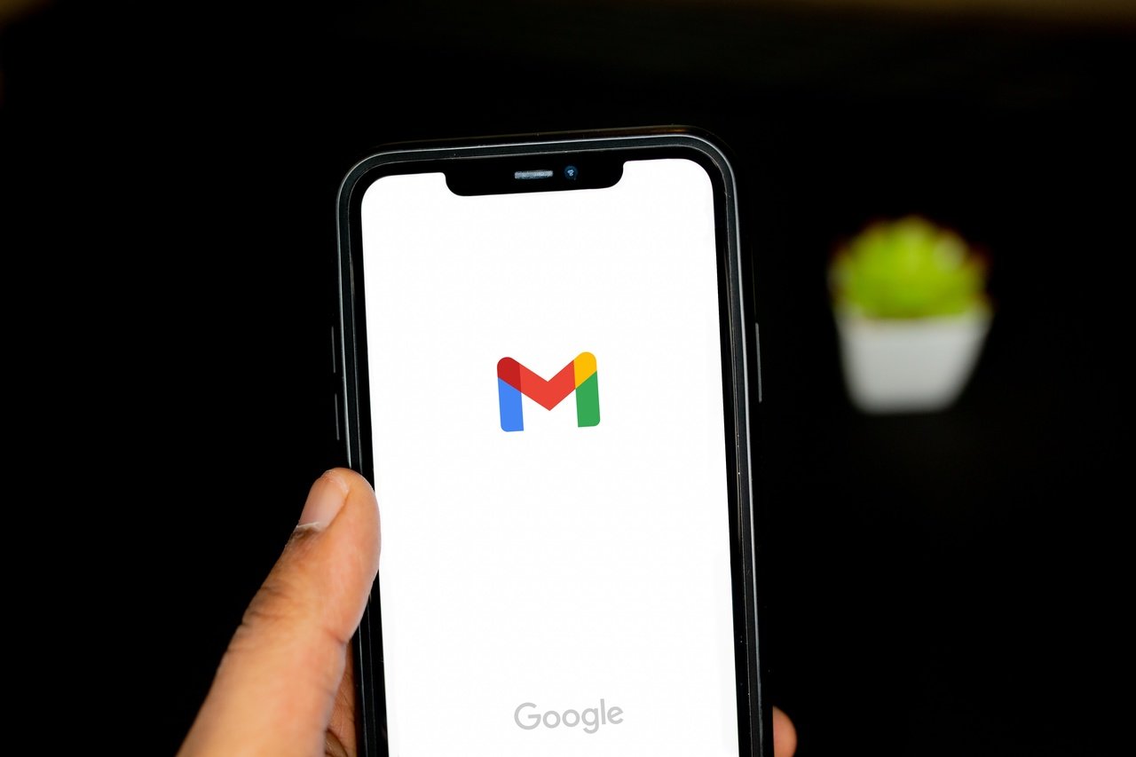 a phone screen showing Gmail app opening