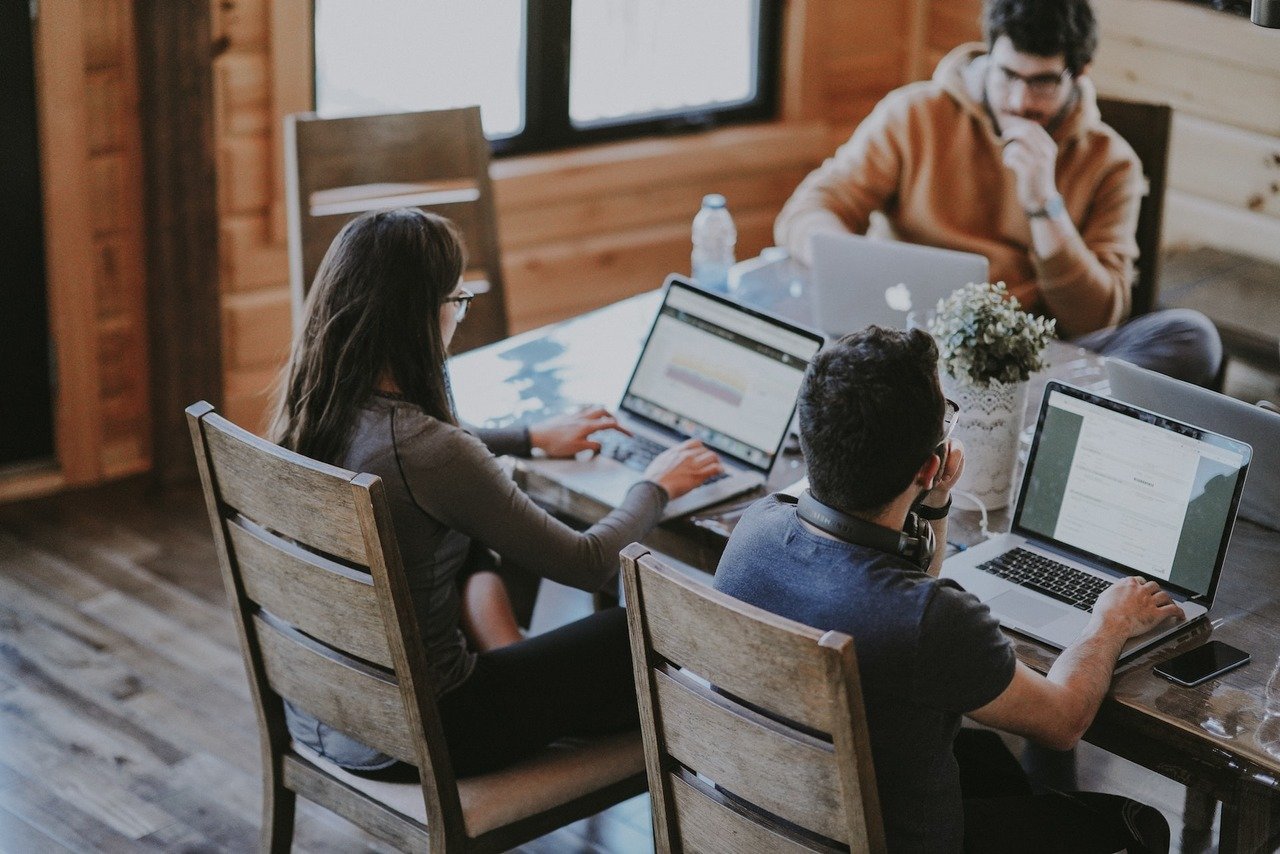 people working together with their laptops