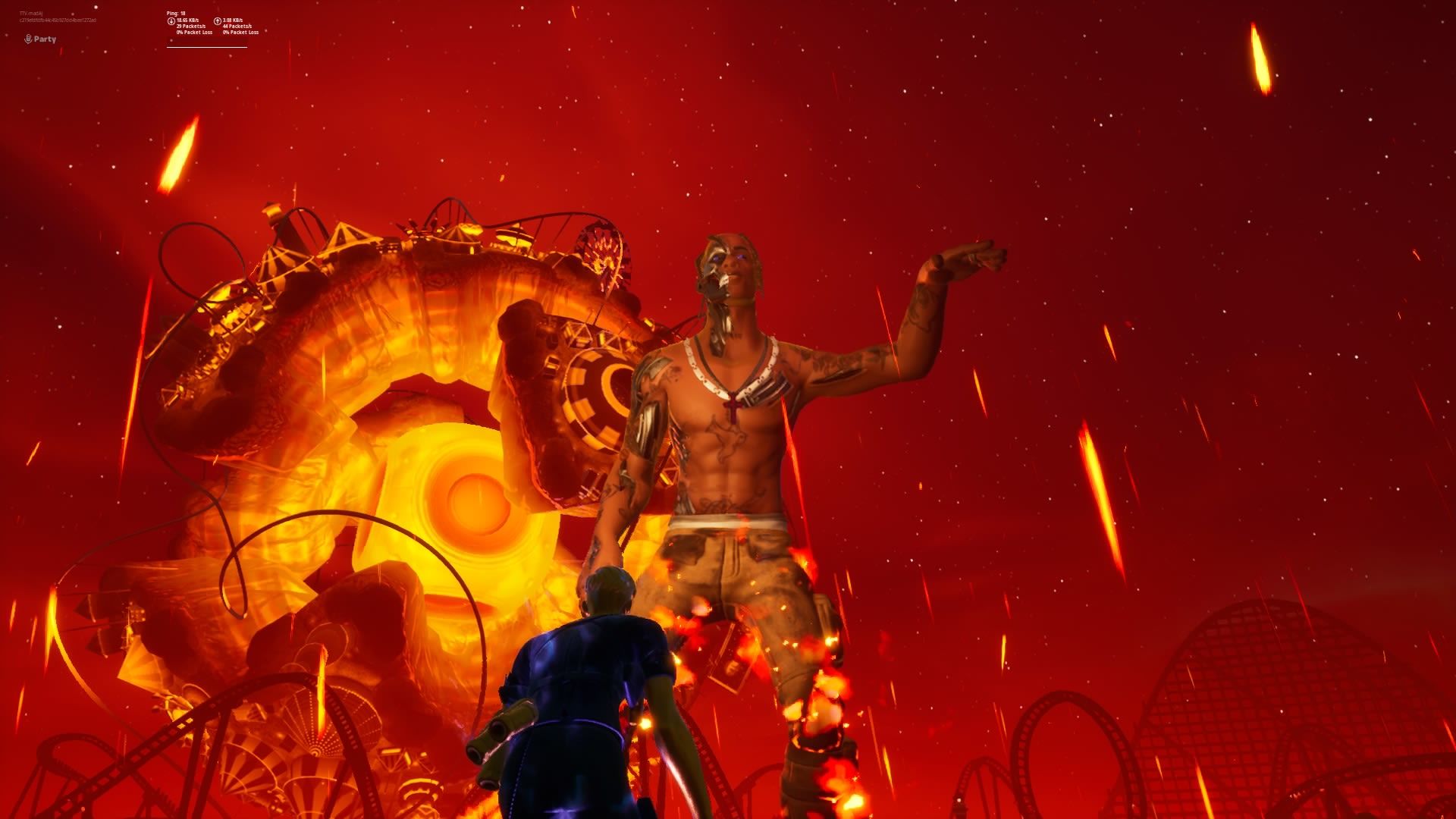 A screenshot of Travis Scott's metaverse Fortnite concert showing Travis Scott as big as the stage, the lights are red and orange and there is one more person much smaller