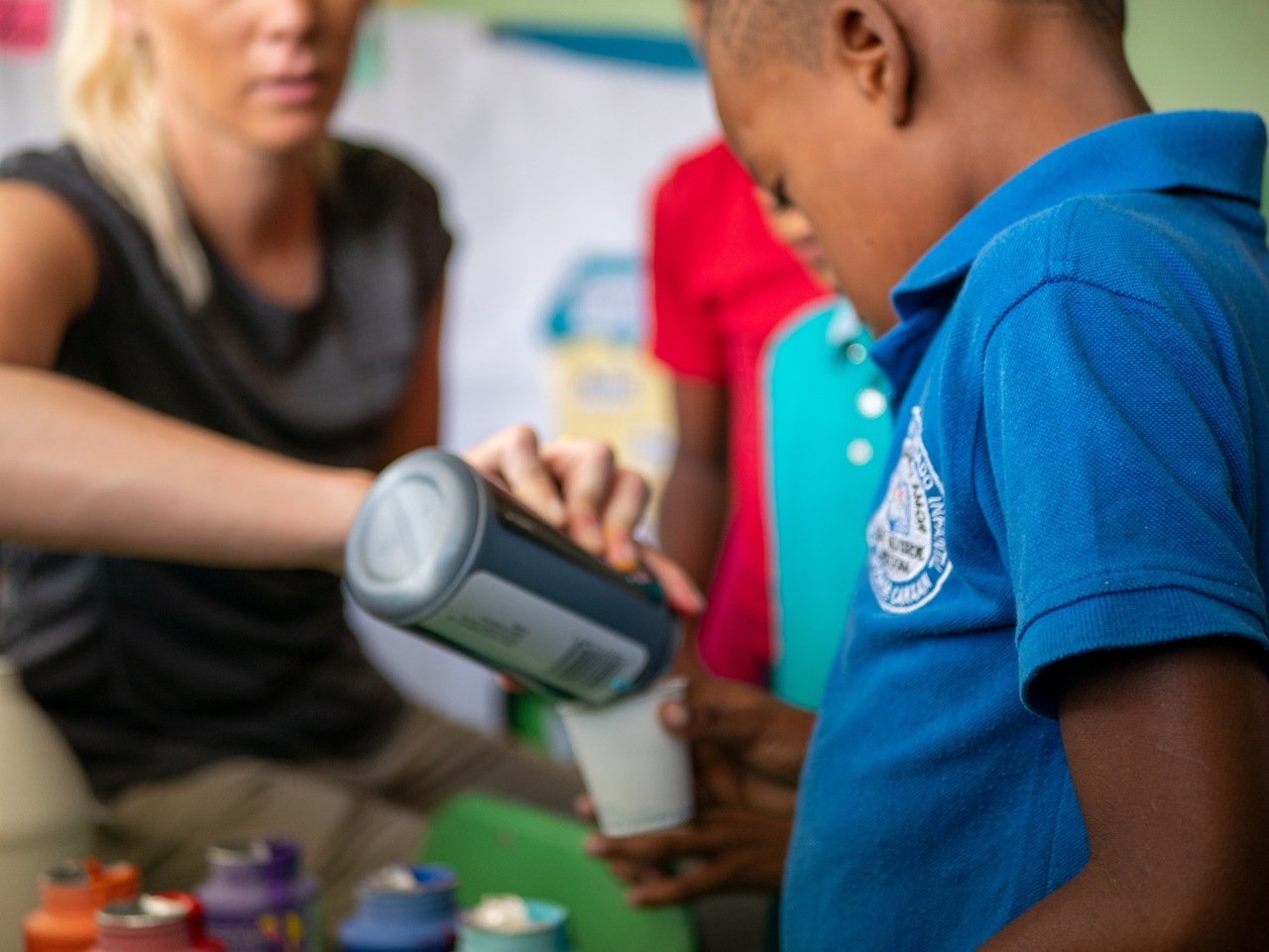 a woman and a child in a charity activity