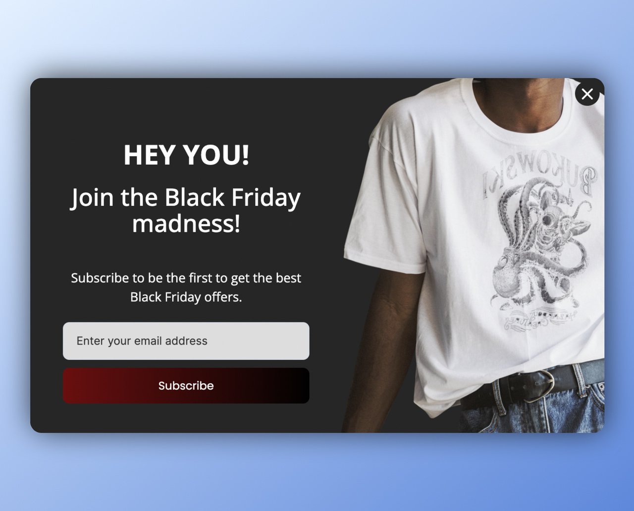 Black Friday popup example for collecting email with "Hey you!" headline and an email box below followed by a red and black gradient subscribe button; on the right, upper body of a person is visible wearing a white tshirt