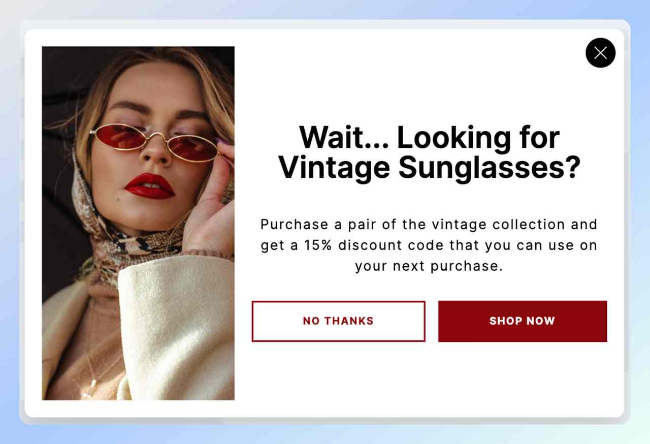 a screenshot of a cart abandonment popup example from Popupsmart with a picture of a girl with red sunglasses