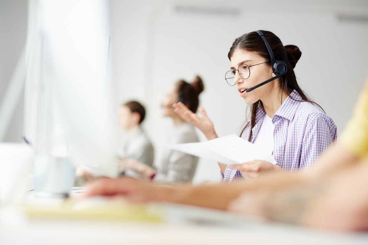 a woman talking to a customer as a customer service representative