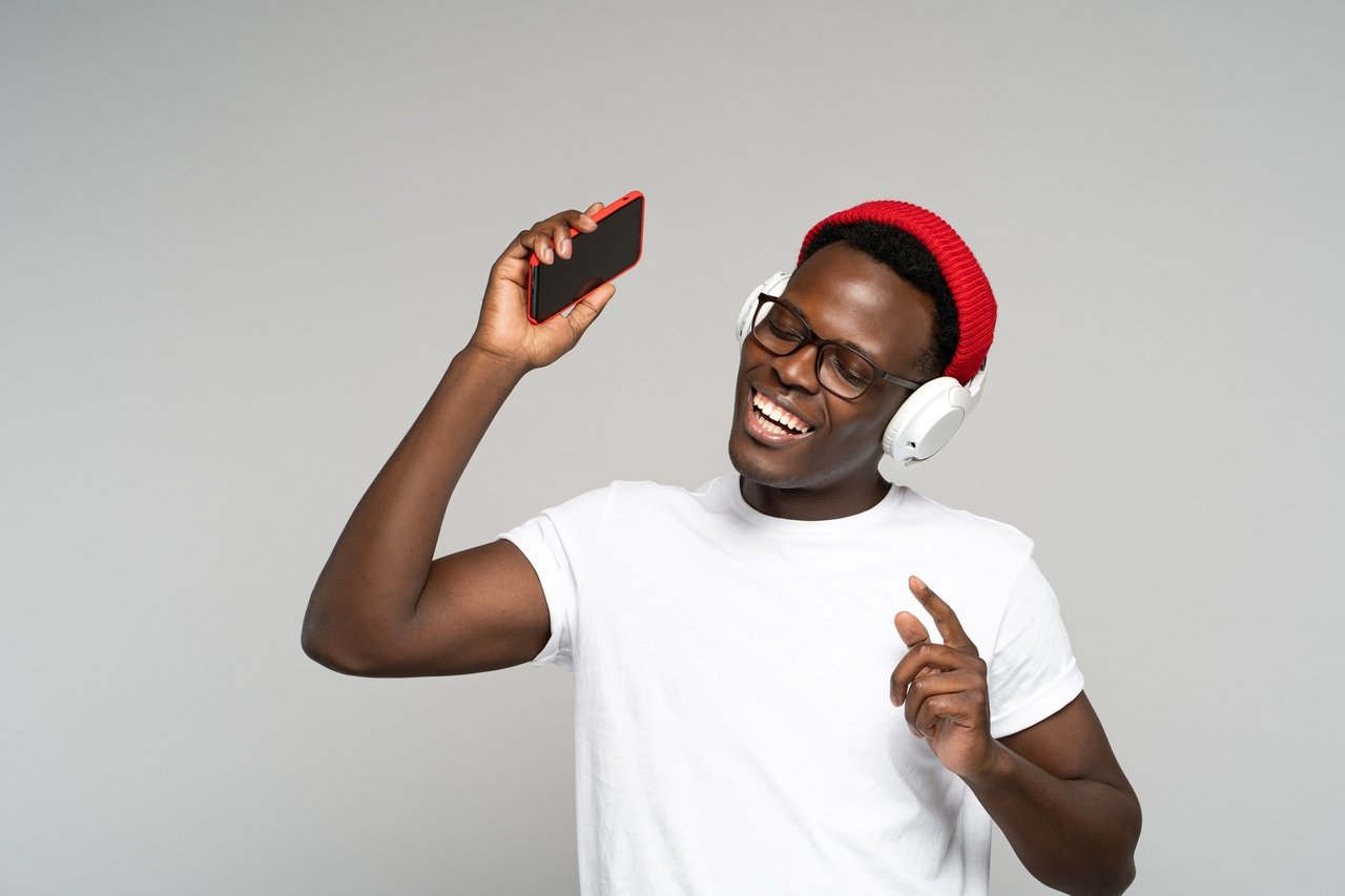 a man with headphones enjoying a personalized list