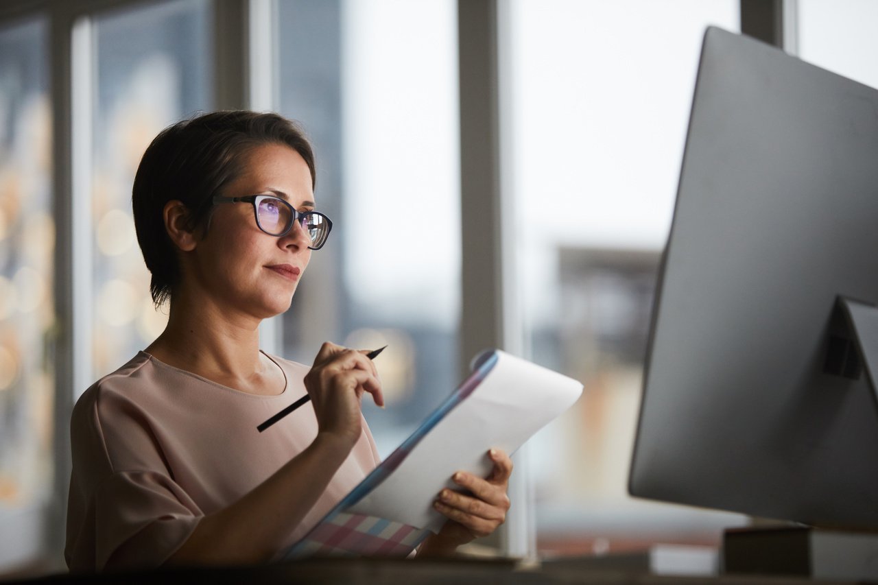 a woman calculating the discounts and offers for presenting to the customers