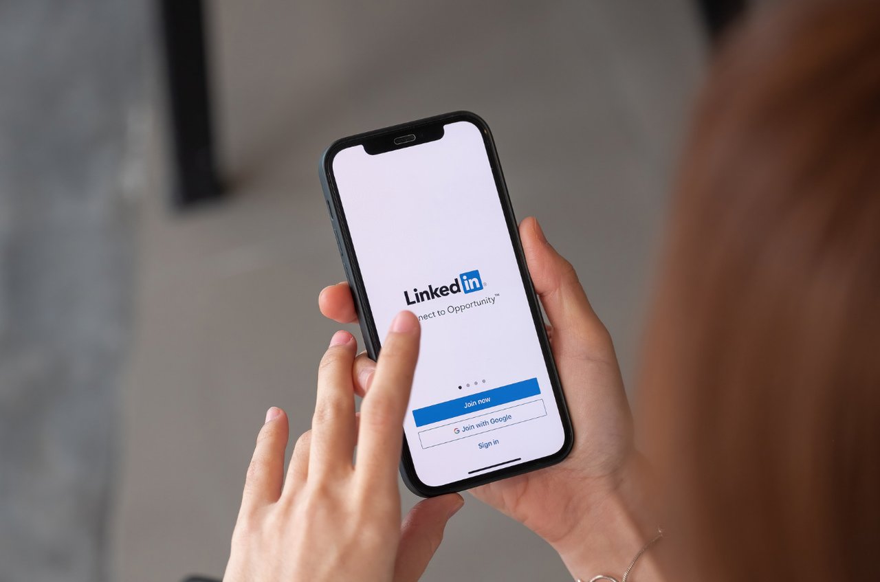 woman using Linkedin on mobile