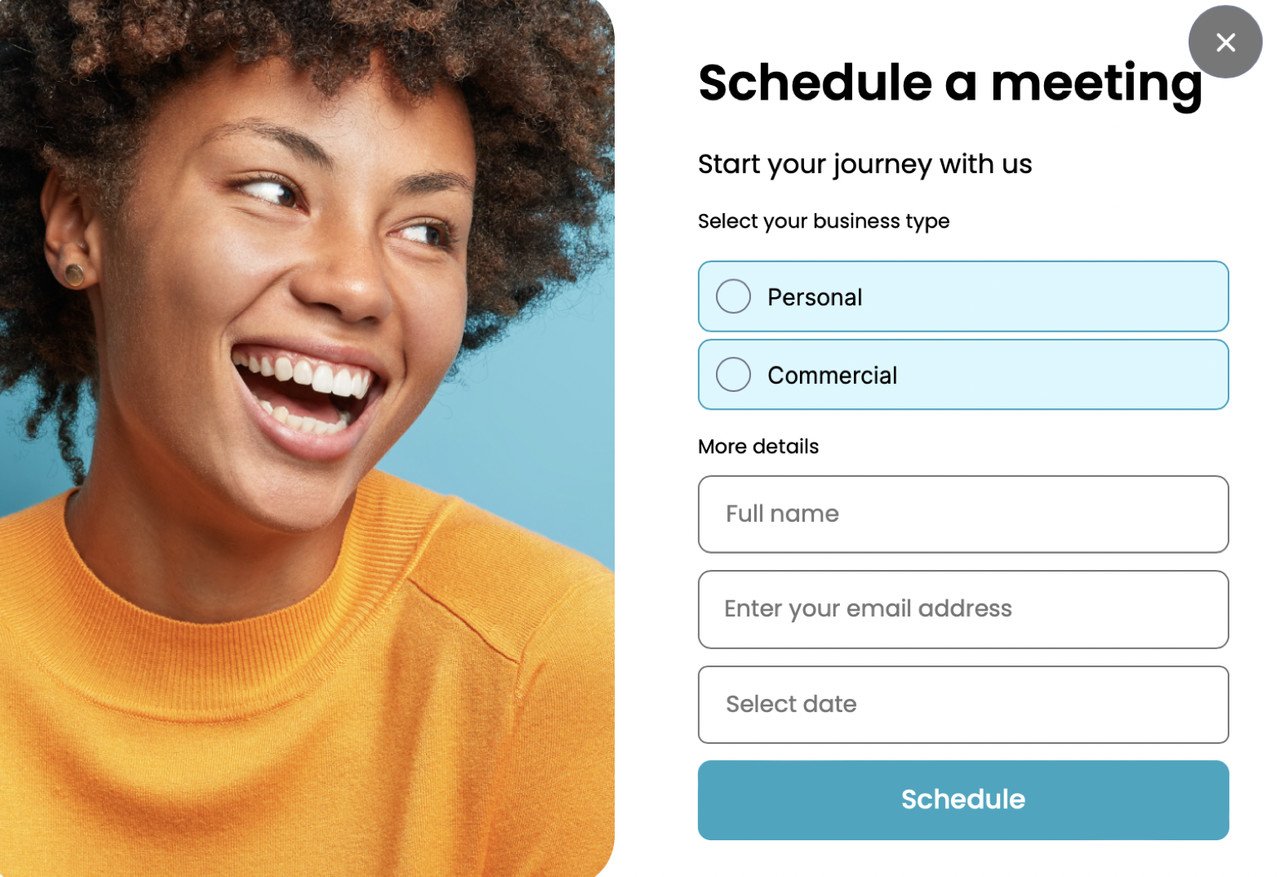 a woman wearing an orange sweater looking at the right direction, laughing and a schedule a meeting form next to her with the fields asking for full name, email address and date