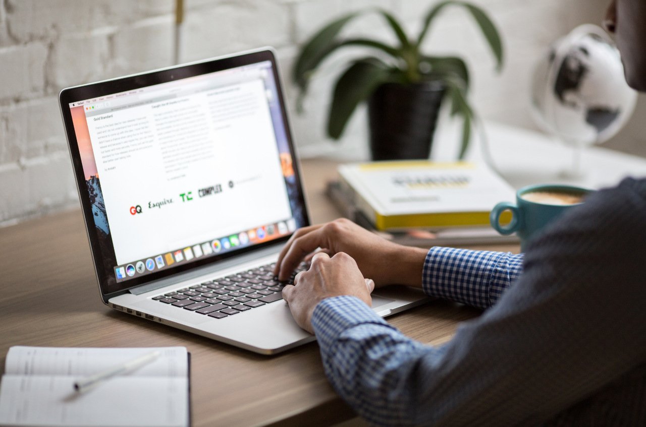 man browsing on laptop