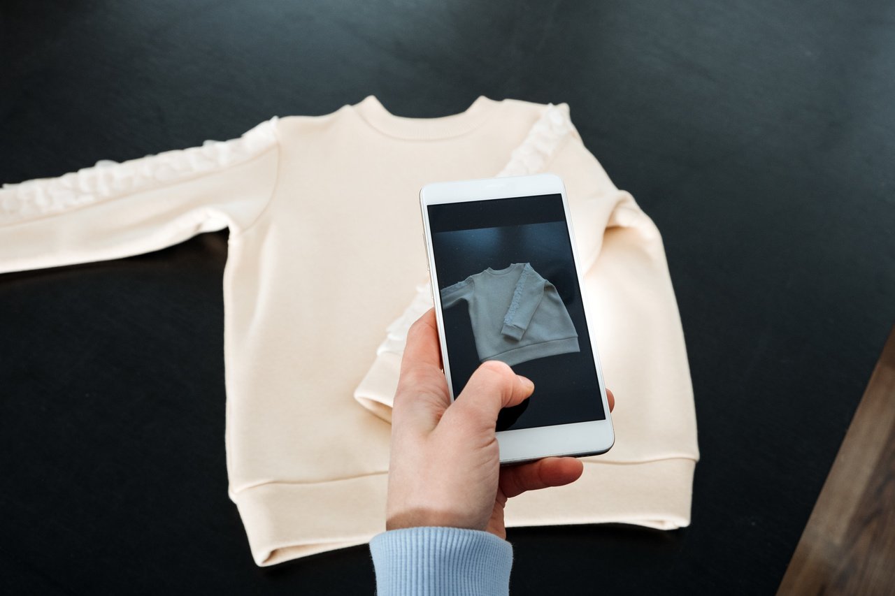 man taking a product picture with his smartphone