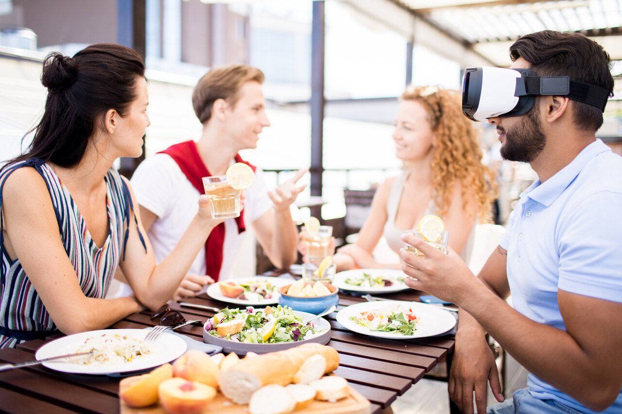 a friend group communicating and eating