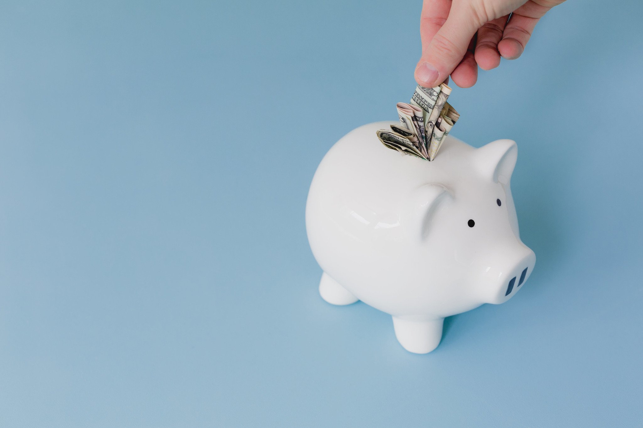 white piggy bank with a blue background