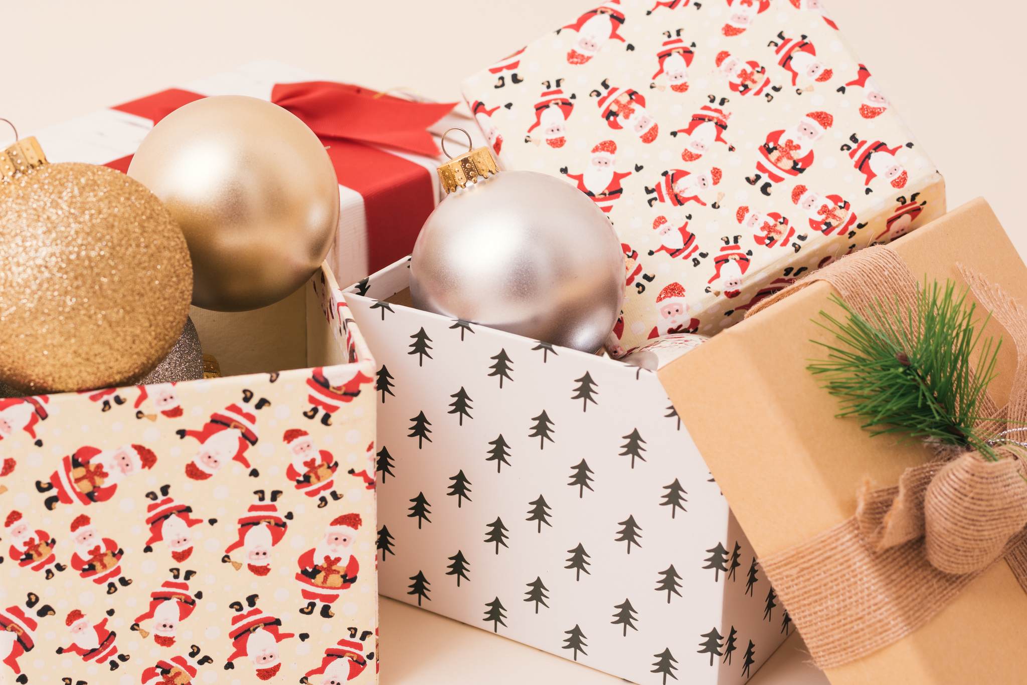 Christmas-themed gift boxes with Christmas ornaments