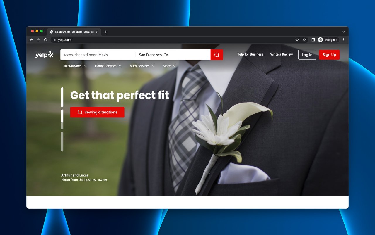 Yelp's homepage with the above-the-fold and a suit with a flower as the image