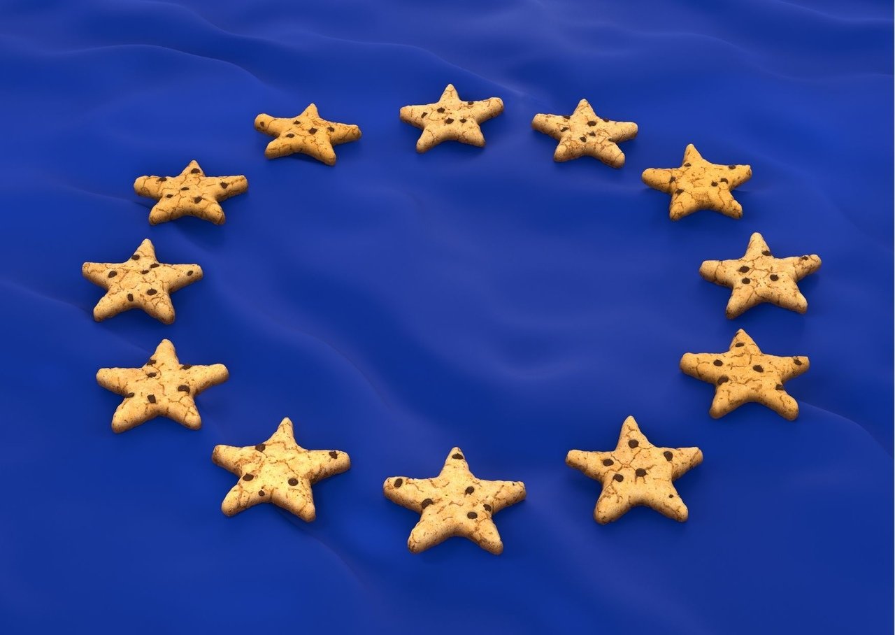 star shaped cookies form a circle on the blue flag associated to the colour of the european union