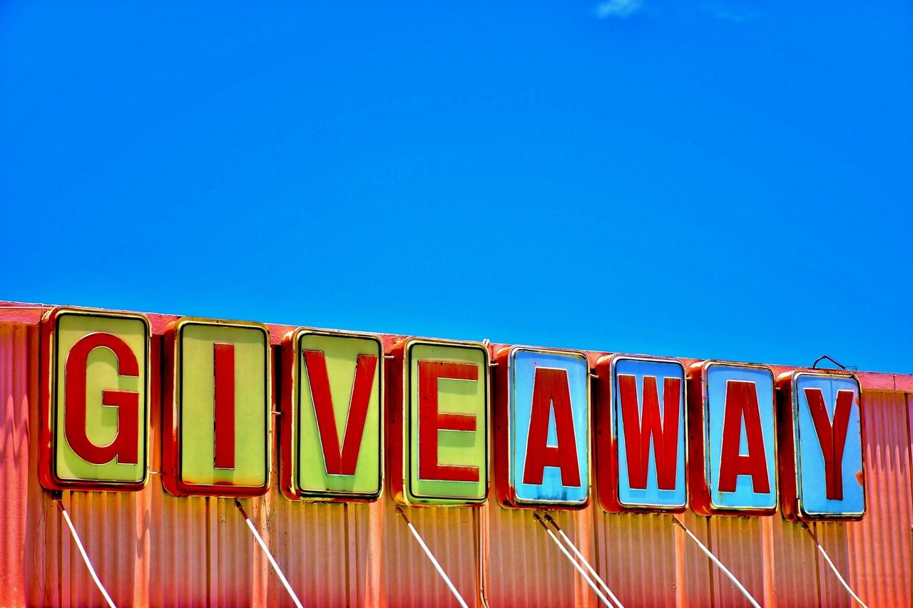 a giveaway sign with a colorful background