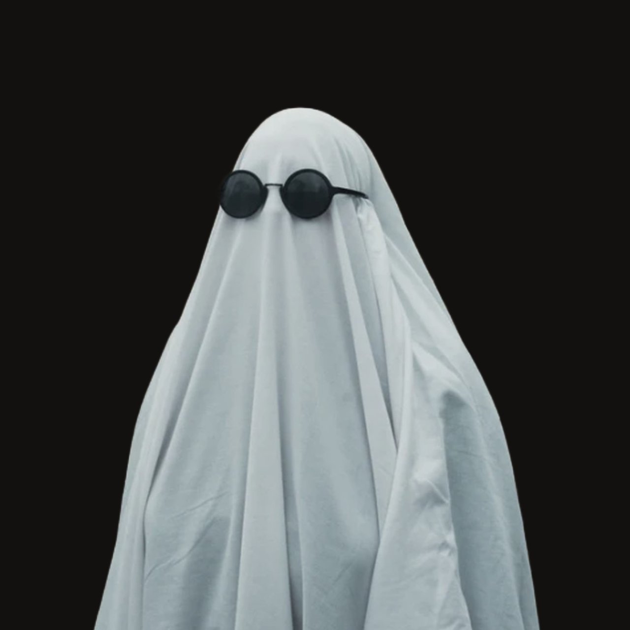 a picture of a human wearing a ghost Halloween custom with sunglasses