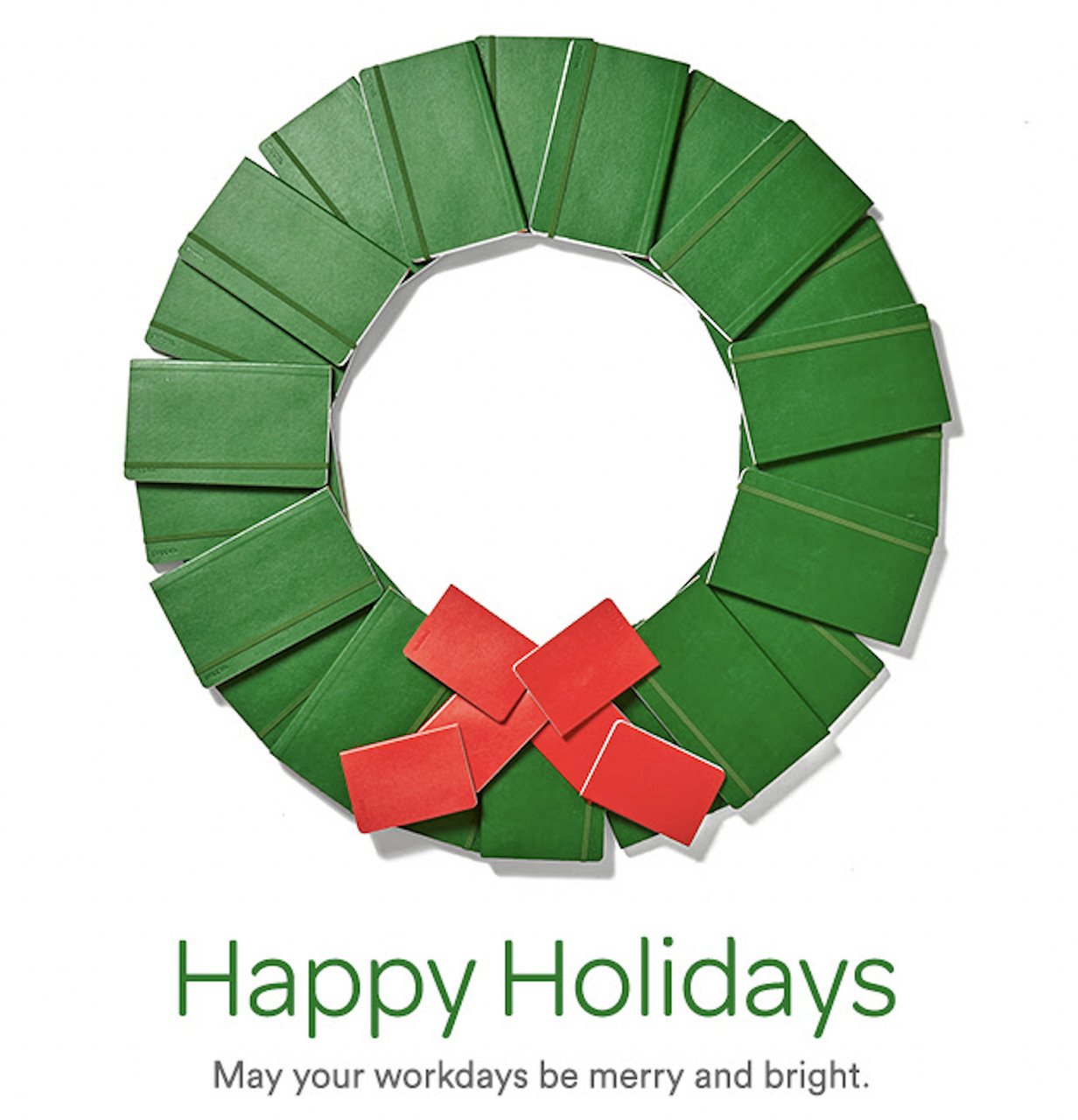 happy holidays email example with a wreath made of cardboard and happy holiday message below, all on a white background