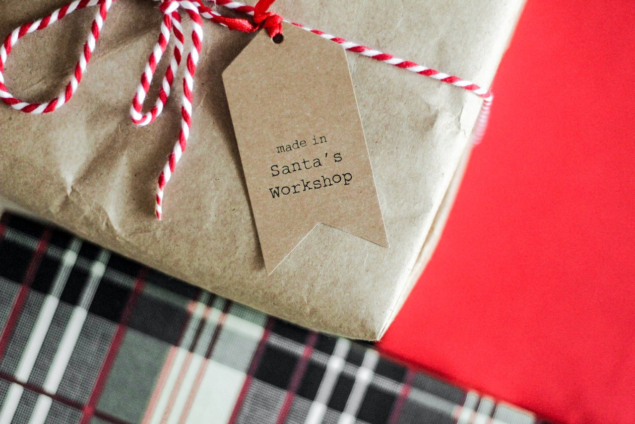 A small part of a gift package with a card attached written "made in santa's workshop