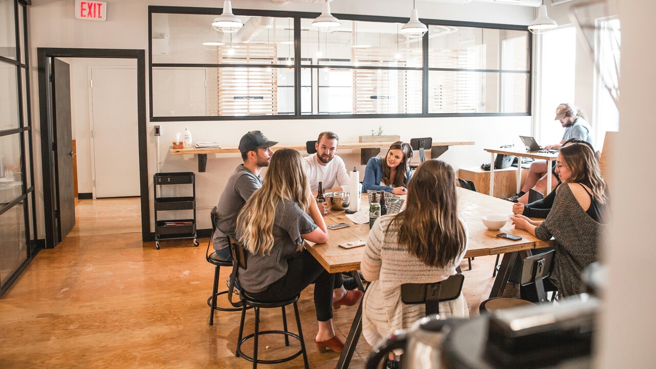 a team having a meeting for email marketing strategy in an office