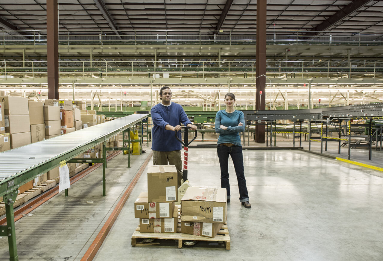 An image of 2 people standing in a warehouse on optimizing order fulfillment accuracy to prevent incorrect deliveries