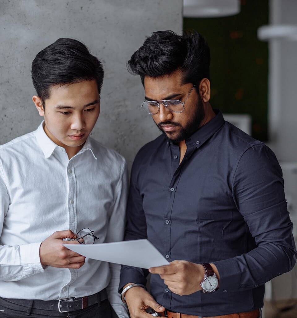 Two people evaluating a paper