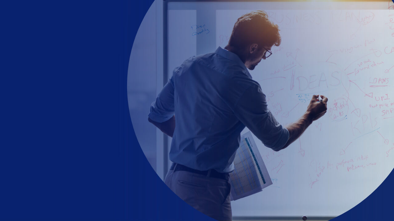 man standing in front of whiteboard