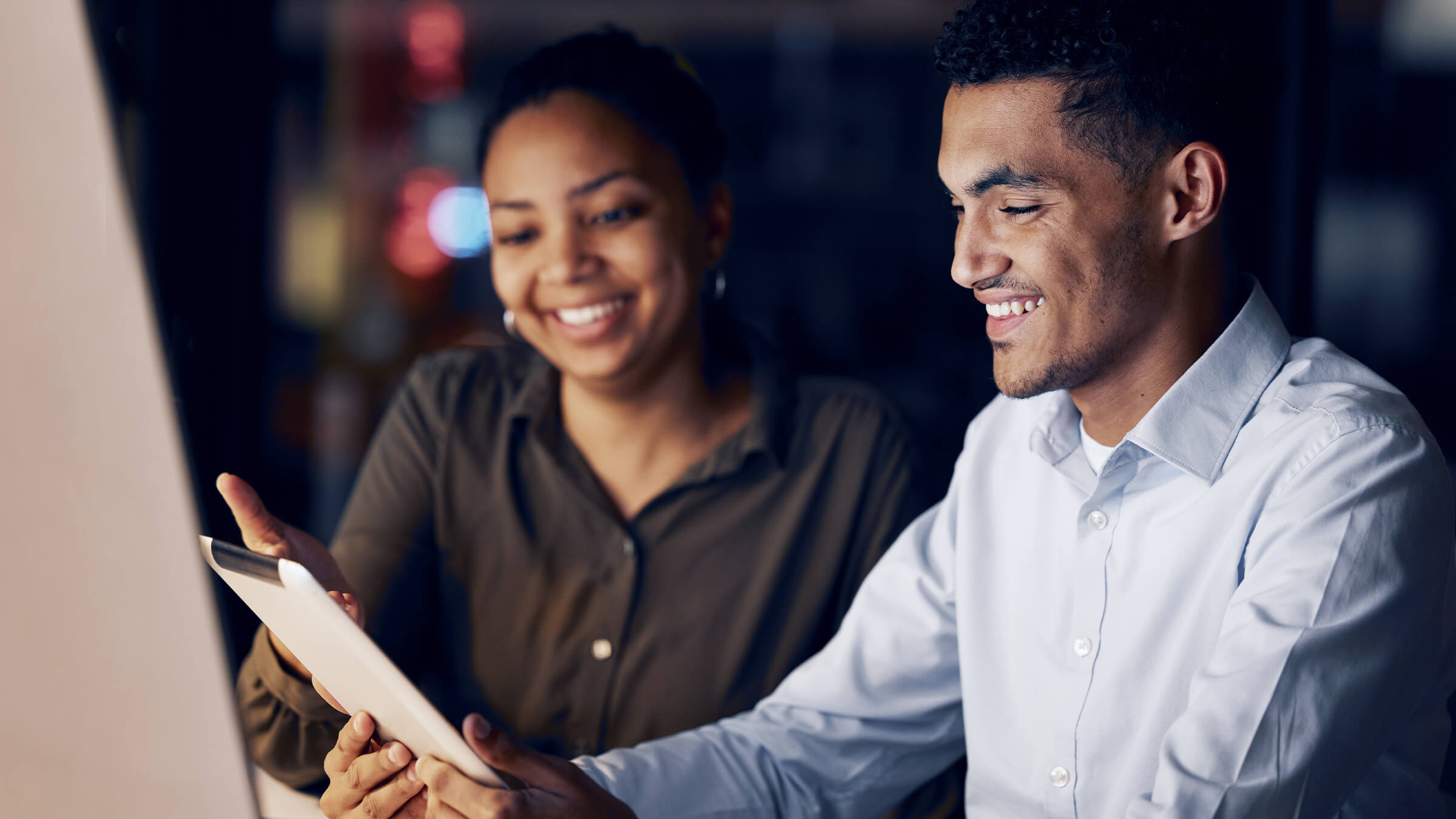 Two people looking at tablet