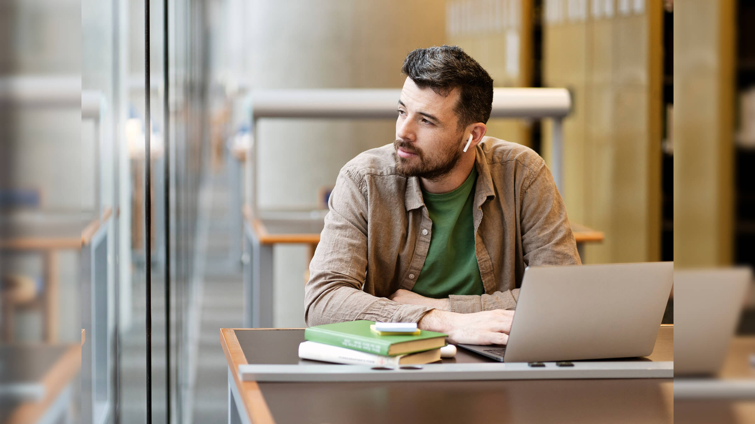 Man with headphones on thinking