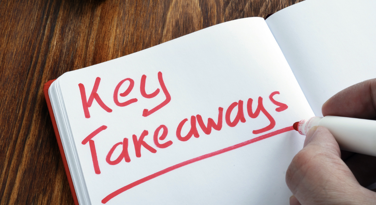 a hand writing ona notebook with red marker "Key Takeaways"