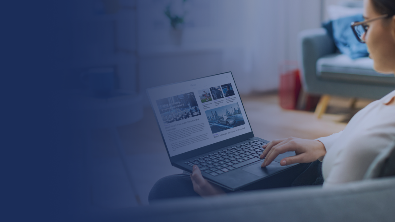 woman reading articles on laptop